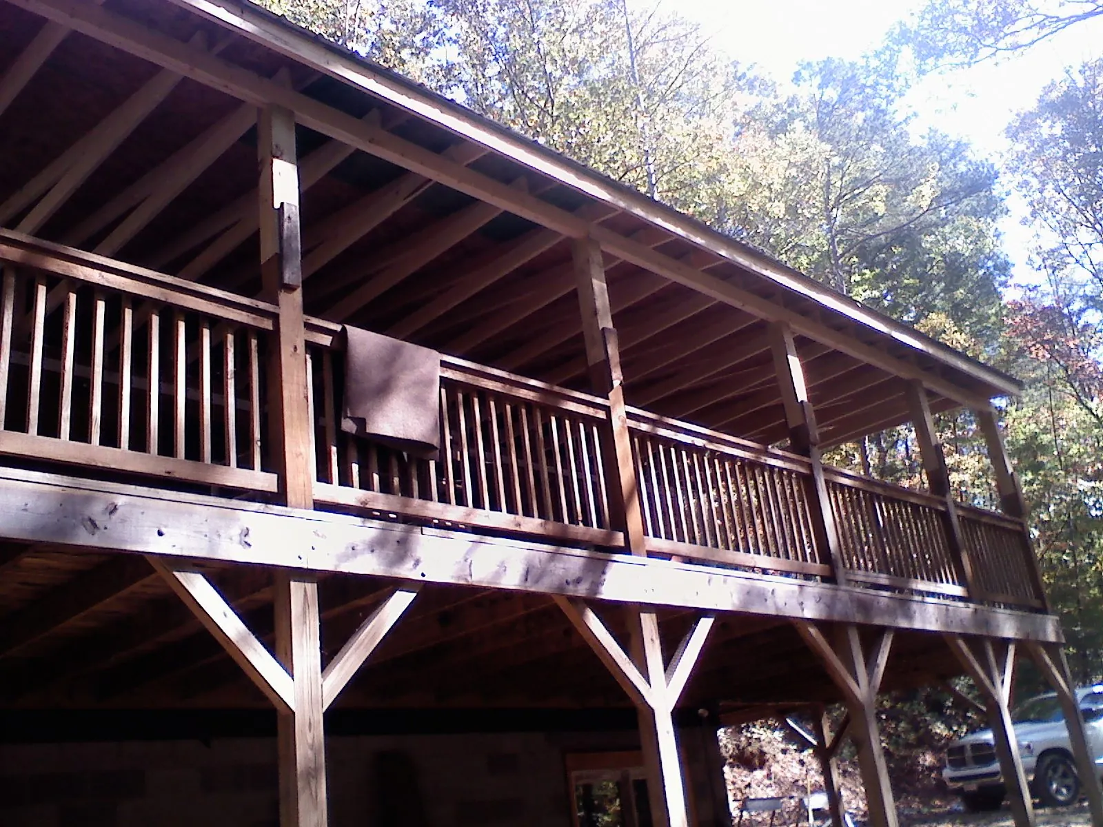 Timber framing under a new elevated porch and deck — Roof Leak Repair in Rochester Mills by Roofing Brothers